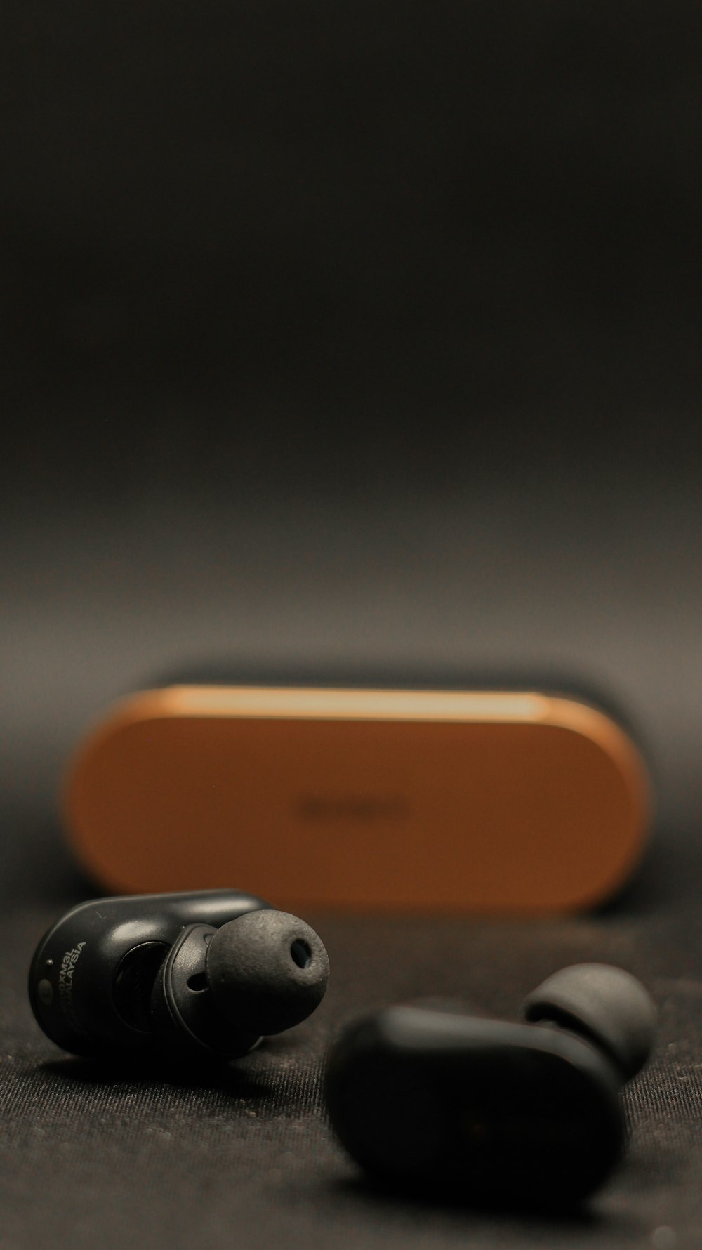 black and orange bluetooth headset