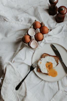 A cozy breakfast spread with eggs, toast, and coffee in a rustic kitchen setting.