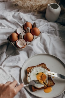 brown eggs on white ceramic plate