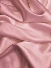 pink textile in close up photography