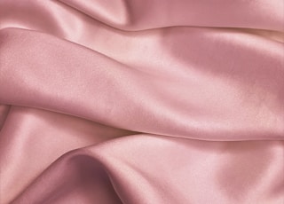 pink textile in close up photography