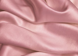 pink textile in close up photography