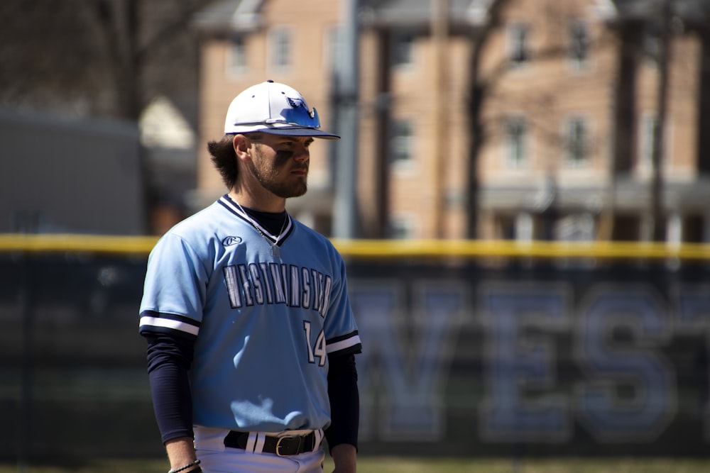 man in blue and white nike jersey shirt wearing blue and white baseball helmet