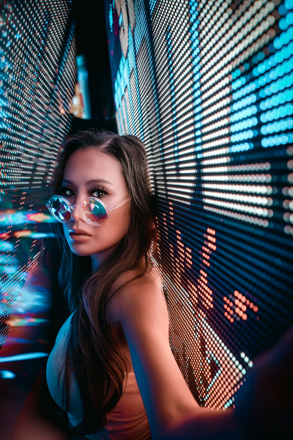 woman in blue tank top wearing eyeglasses