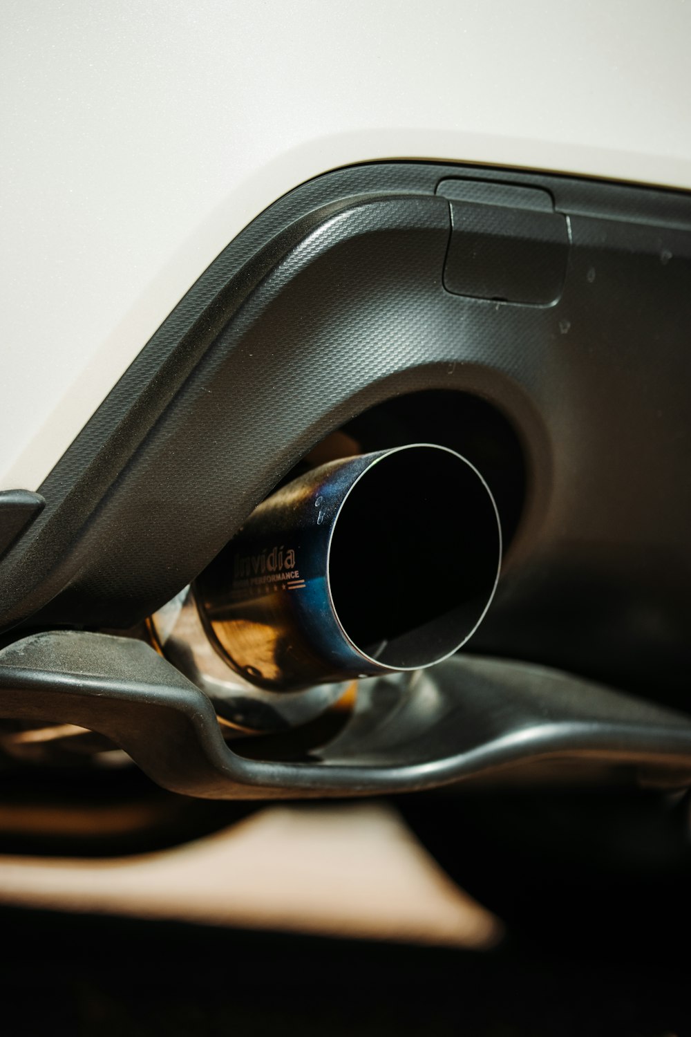 black and silver coffee cup on car dashboard