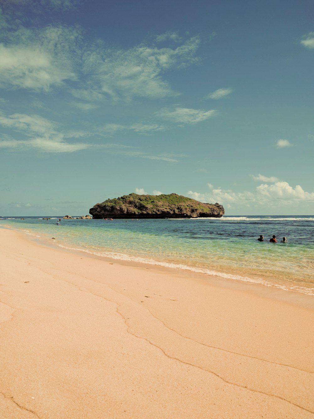 brown rock formation on sea shore during daytime