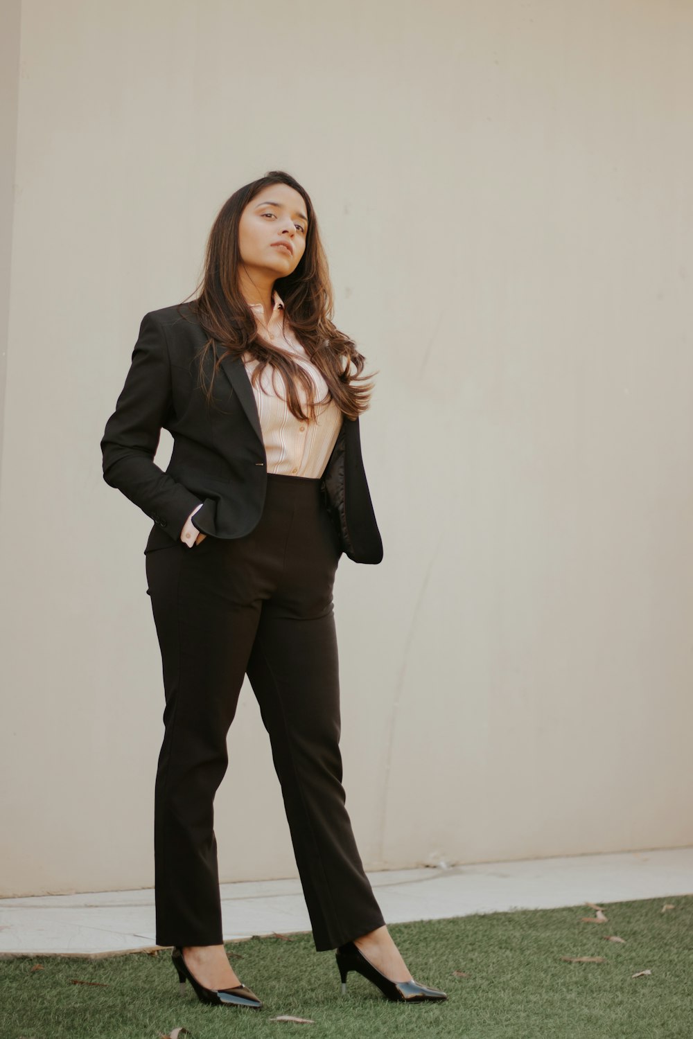 woman in black blazer and black pants