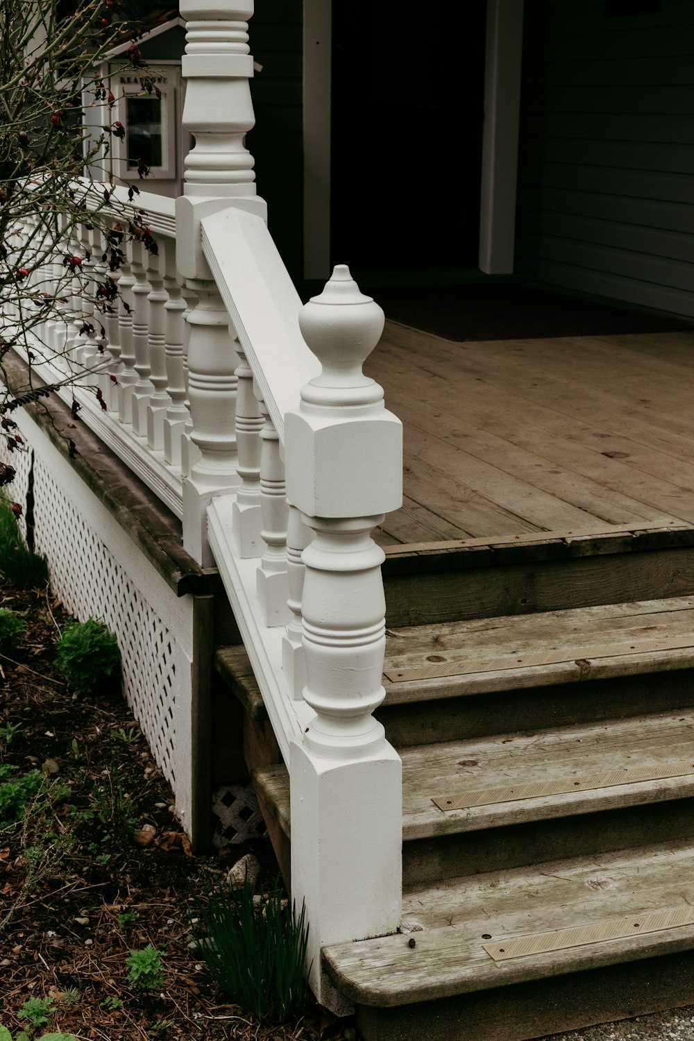 white wooden fence near bare tree during daytime