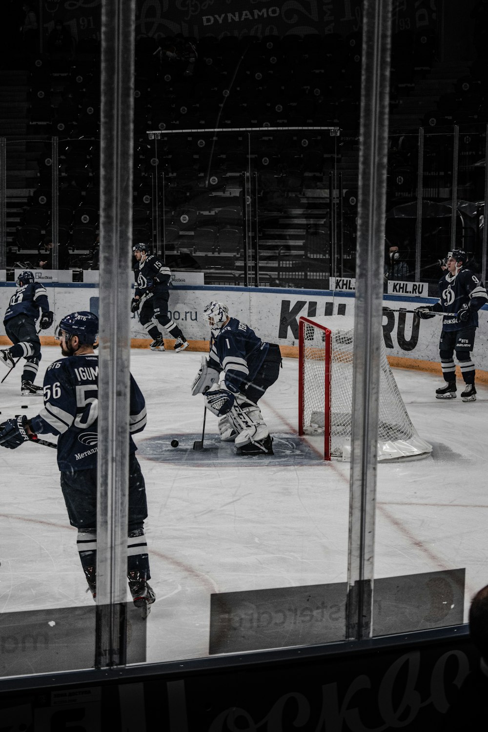 2 men playing ice hockey