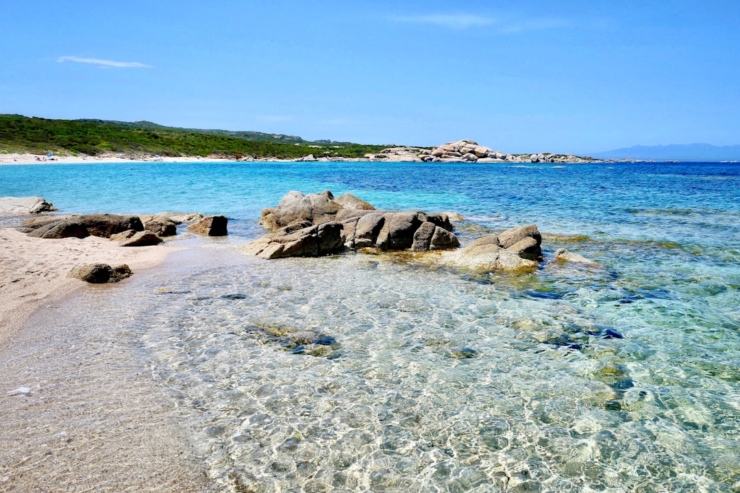 brown rocks on blue sea under blue sky during daytime