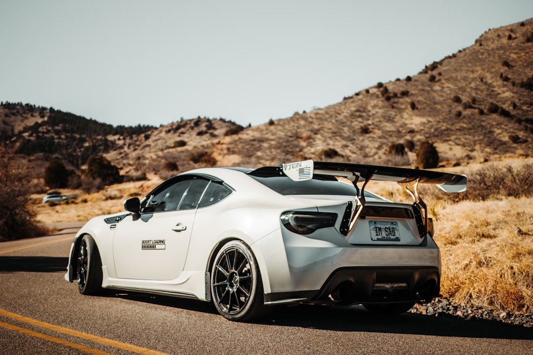 white porsche 911 on road during daytime