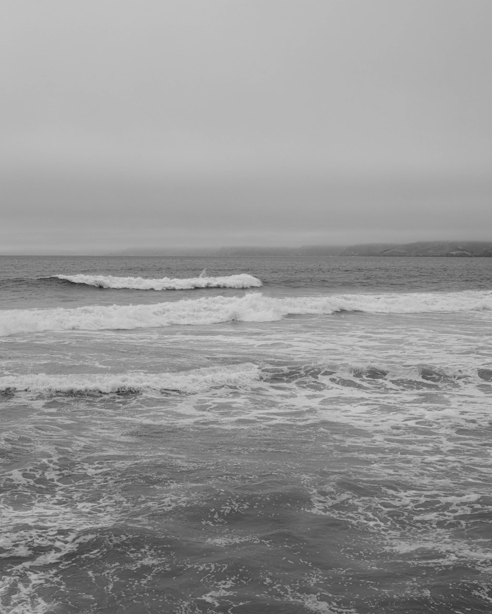 grayscale photo of ocean waves