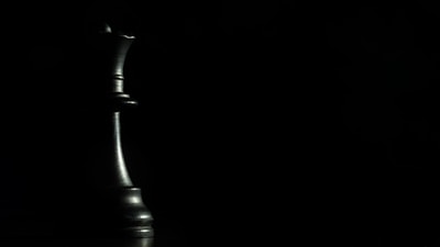 An overview of the Queens Puzzle grid with crowns perfectly aligned, set against the calming light green background.