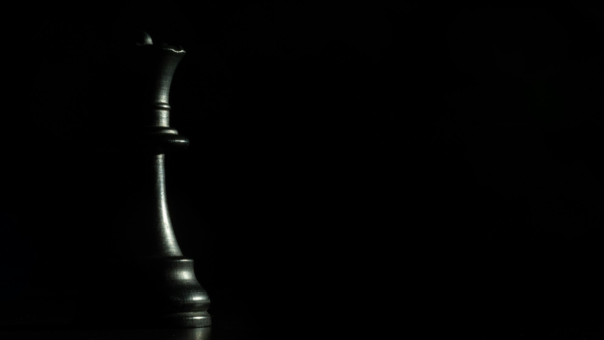 black steel candle holder with black background