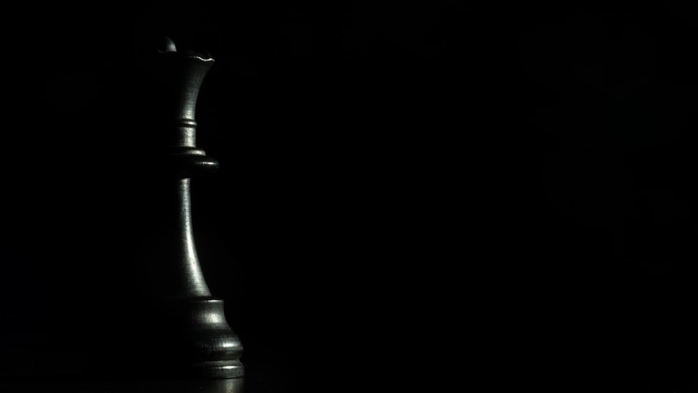 black steel candle holder with black background