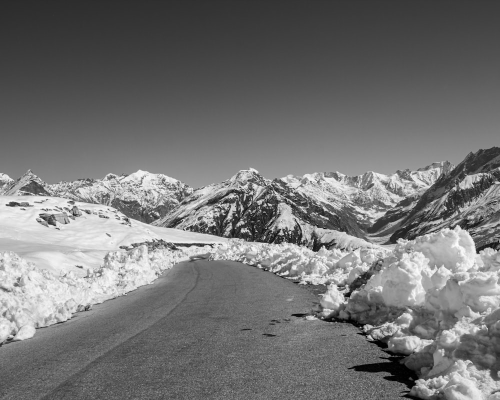 grayscale photo of mountain covered by snow