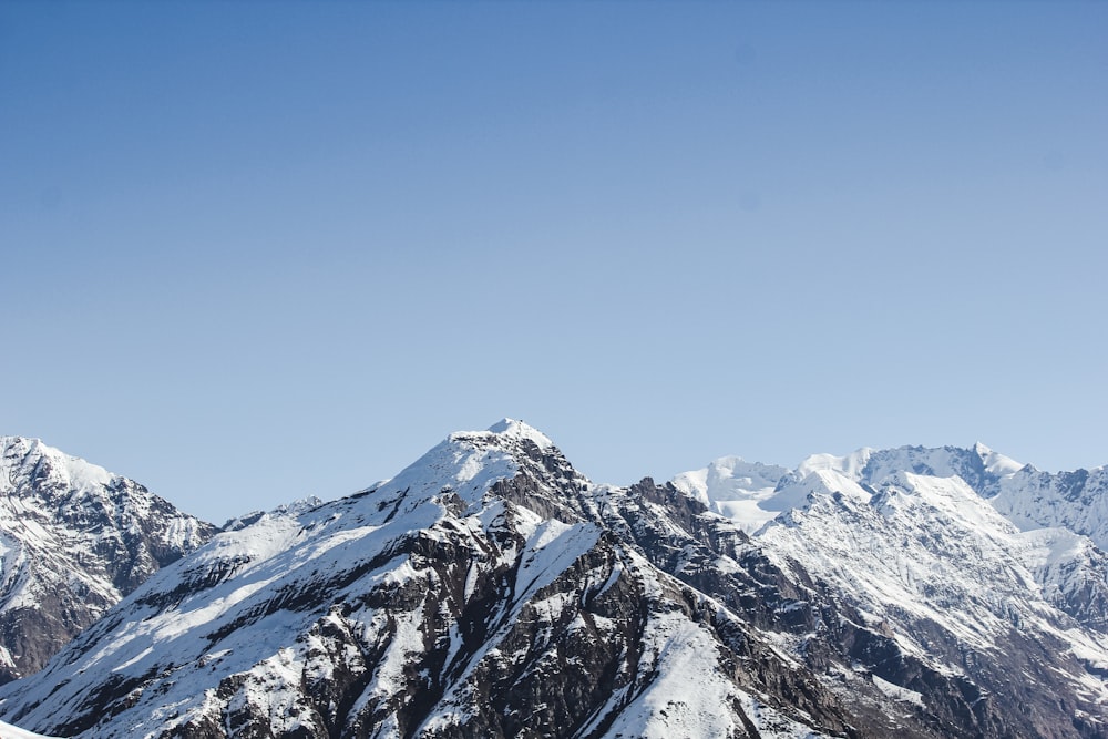 snow covered mountain under blue sky during daytime