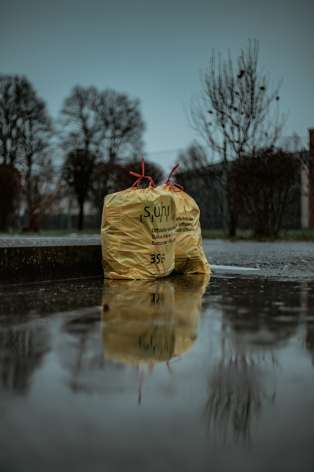 person in brown jacket and brown pants standing on water