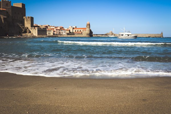 Waves on the beach below the château — Collioure, France