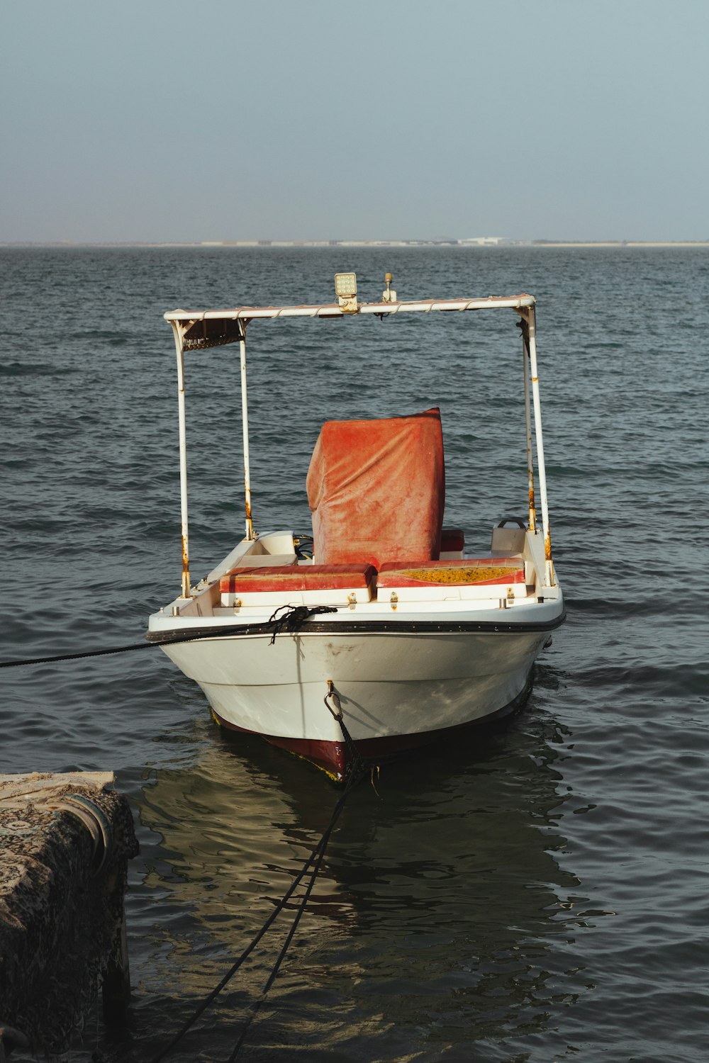 white and brown boat on sea during daytime