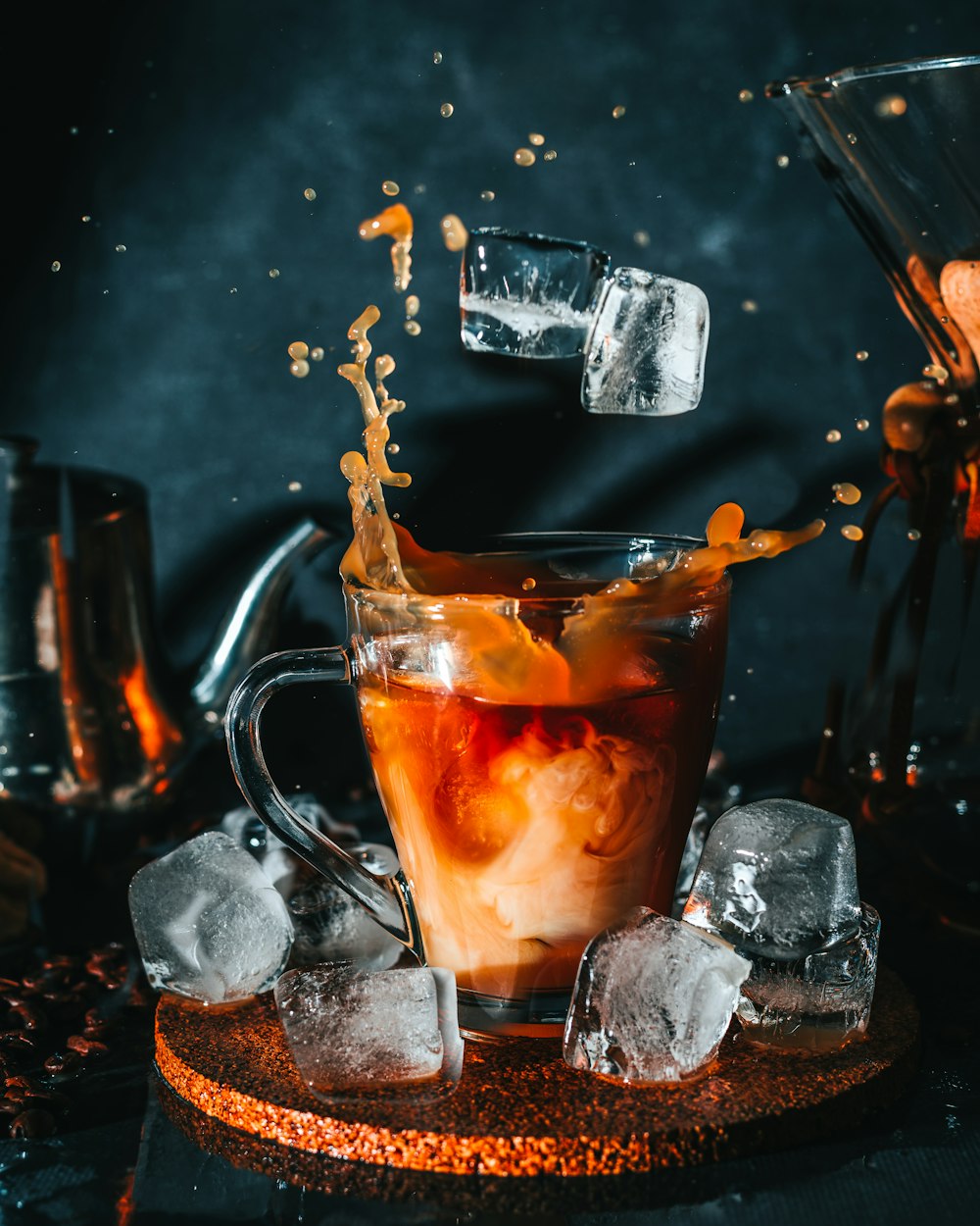 clear glass mug with brown liquid inside