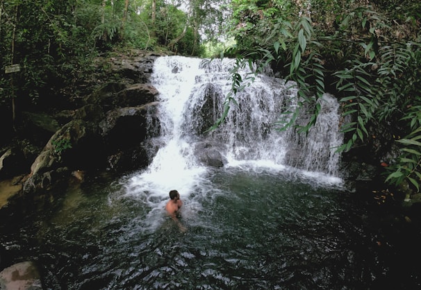 Crystal-clear waterfall cascading into the natural pool designed for hydrotherapy.