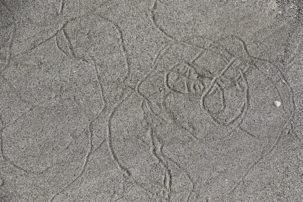 gray sand with heart drawing