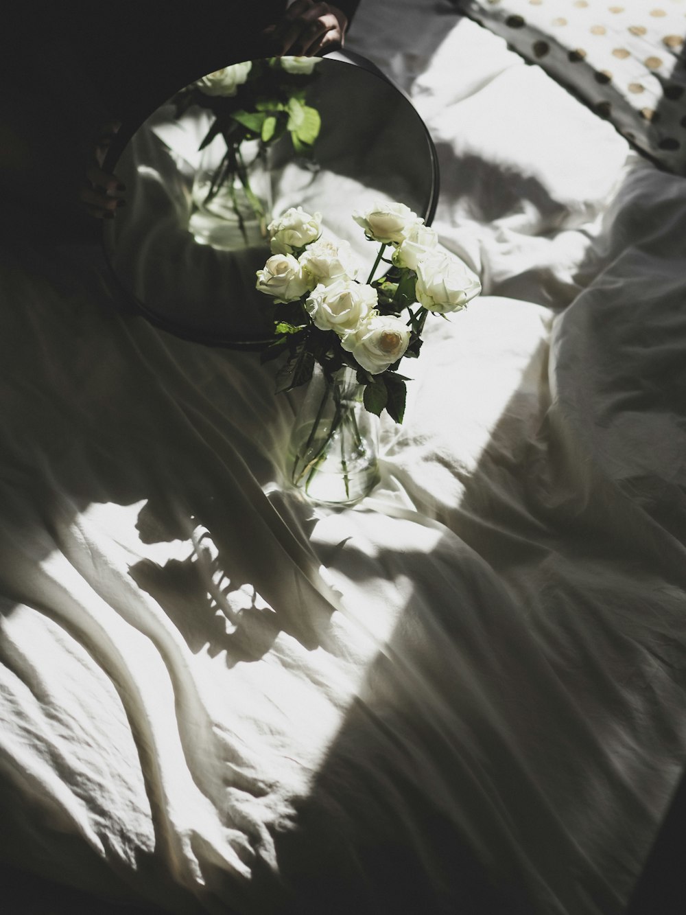 white roses on white textile