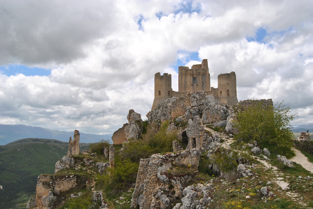 brown concrete castle under white clouds during daytime