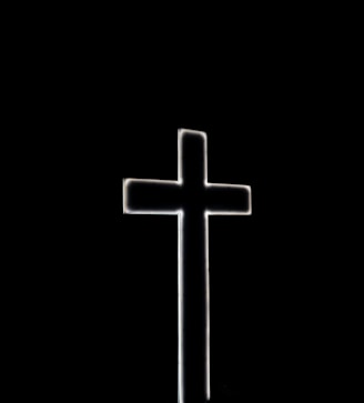 white cross with black background