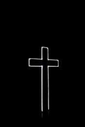 white cross with black background