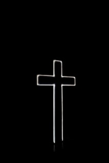 white cross with black background