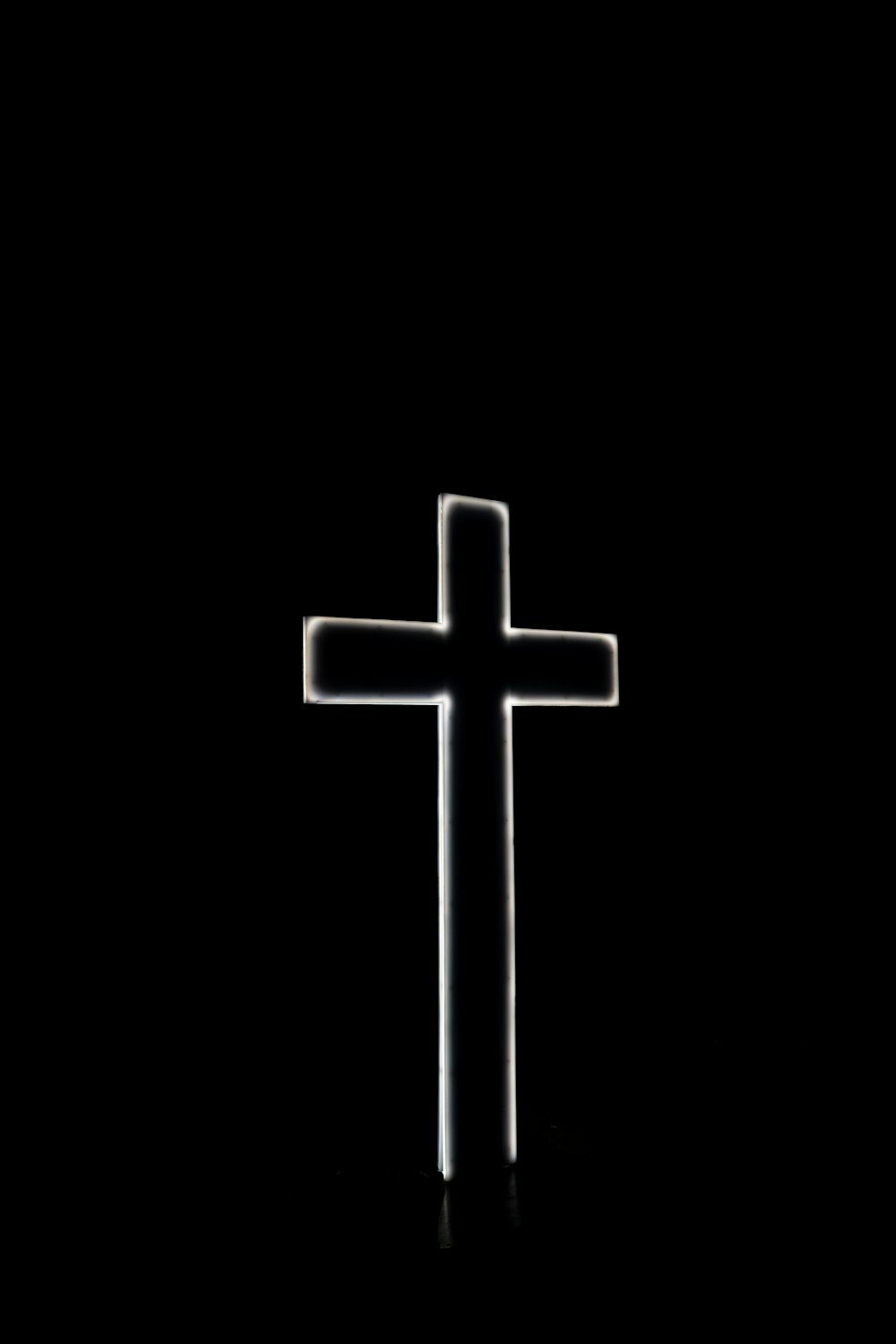 white cross with black background