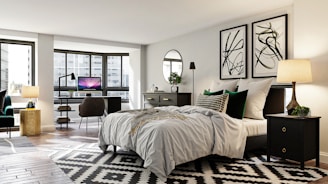 white bed linen near black flat screen tv