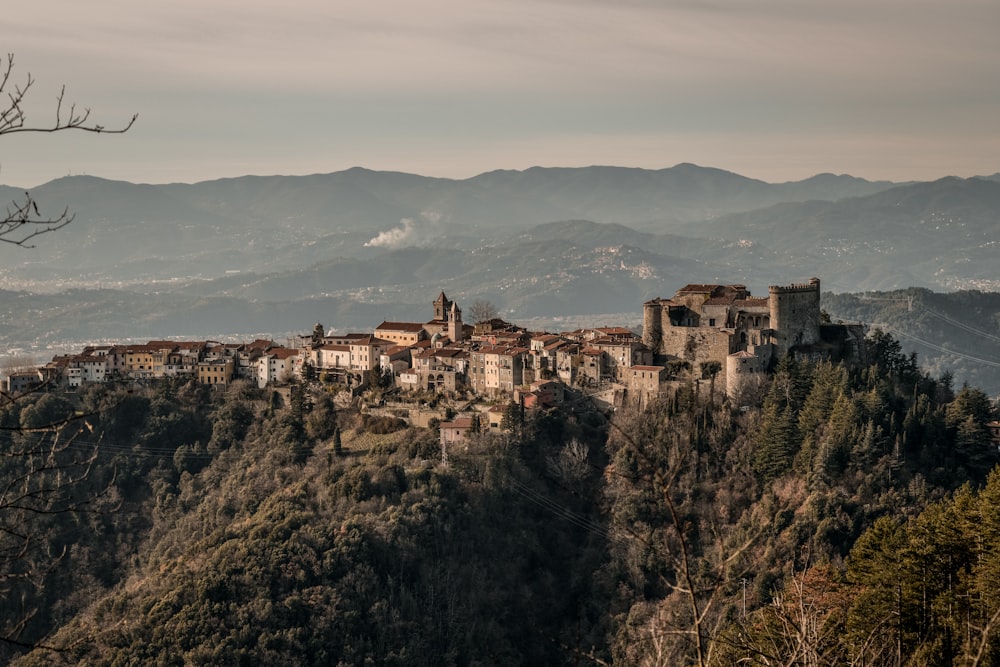 brown concrete building on top of mountain during daytime