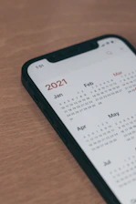 black samsung android smartphone on brown wooden table