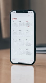 black android smartphone on brown wooden table