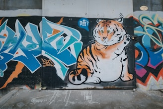 A vibrant mural of a roaring beast bursting through urban graffiti walls.
