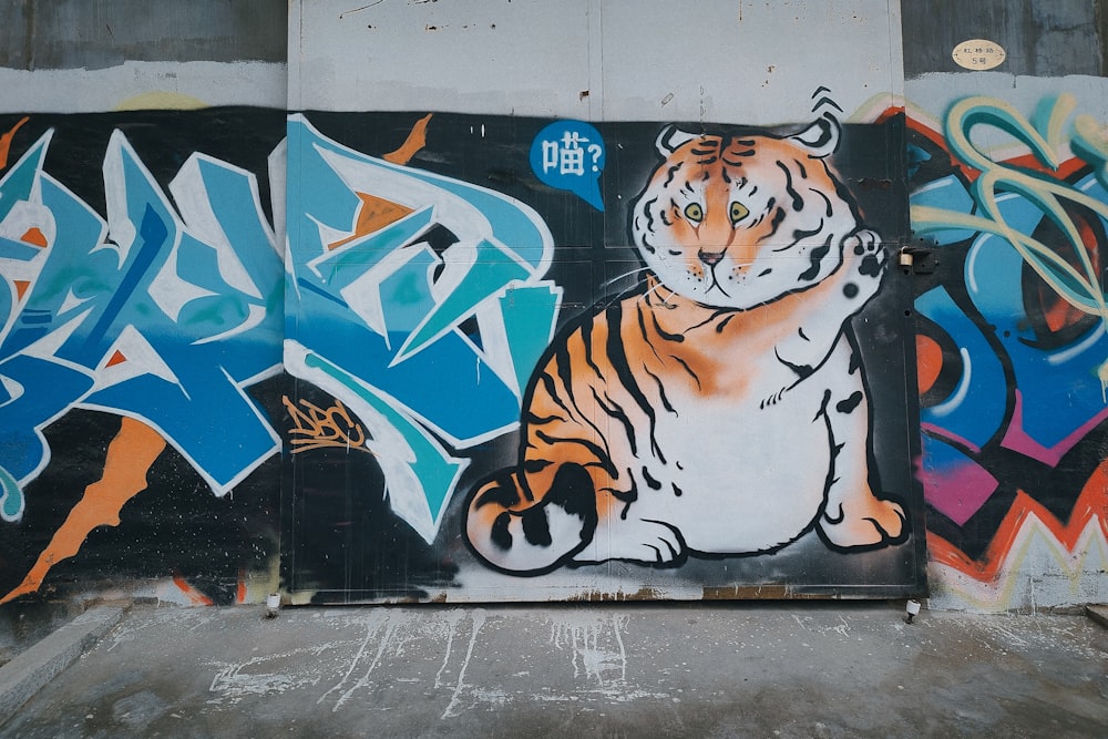 tiger graffiti on wall during daytime