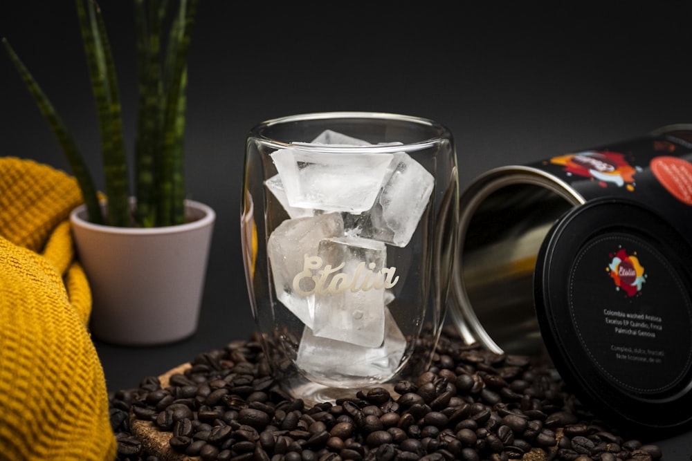 clear glass mug on coffee beans