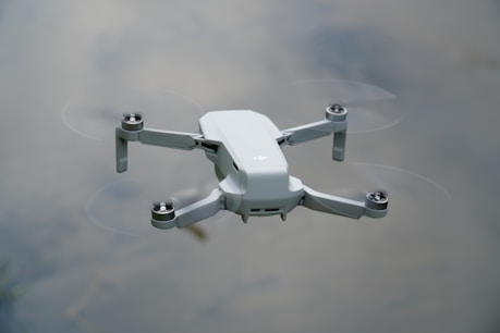 white drone on white surface