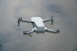 white drone on white surface