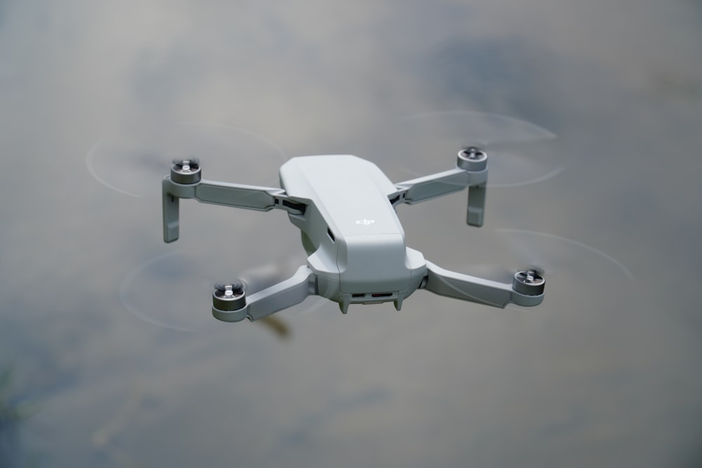 white drone on white surface