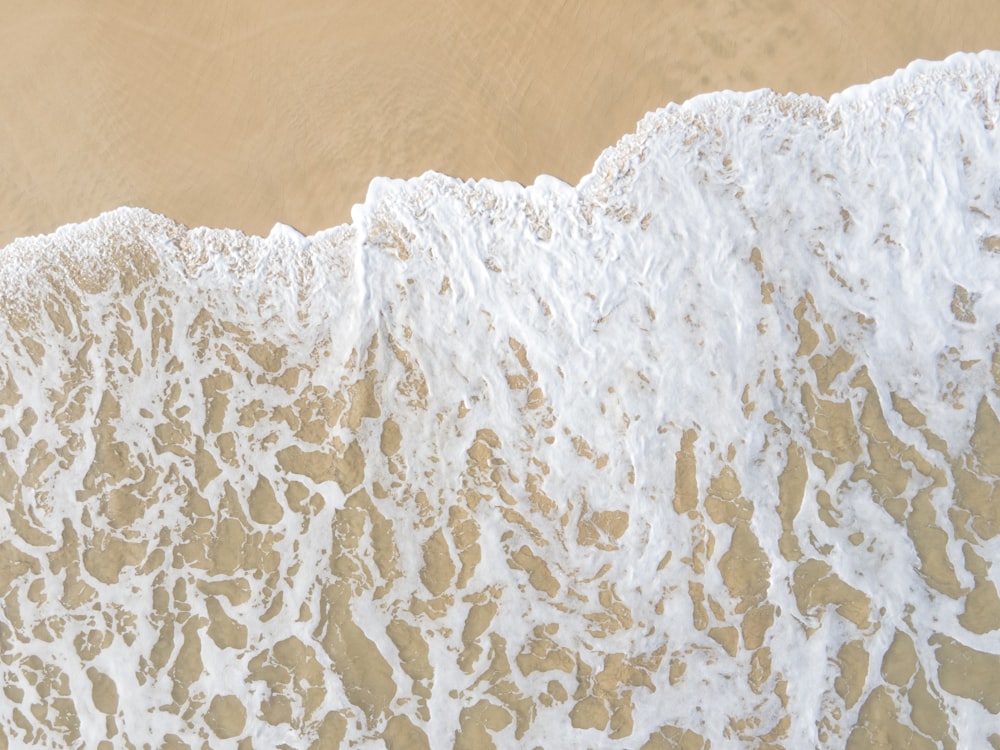 white ice on brown sand