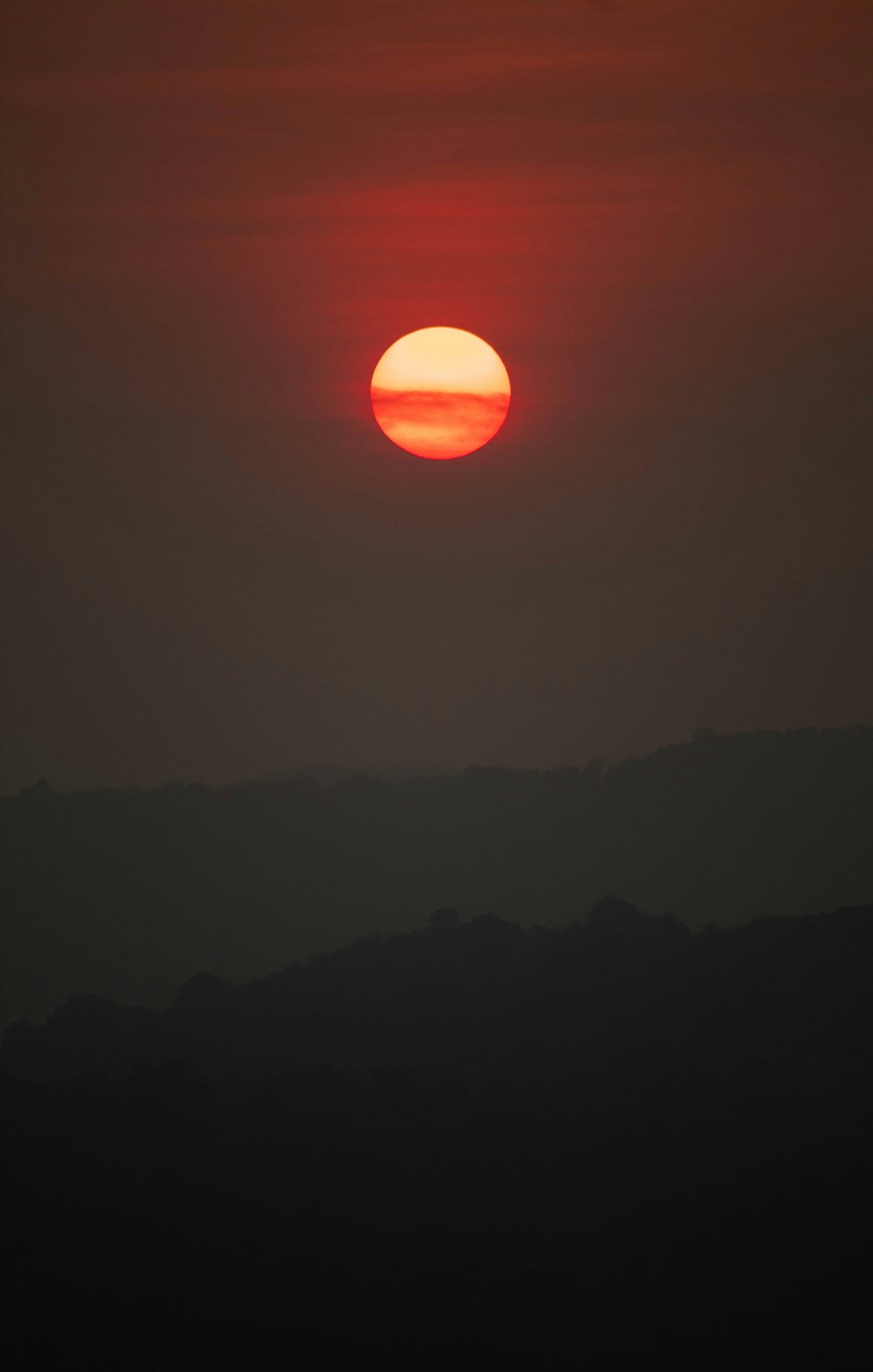 silhouette of mountain during sunset