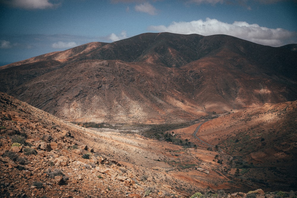 brown and green mountains under blue sky during daytime