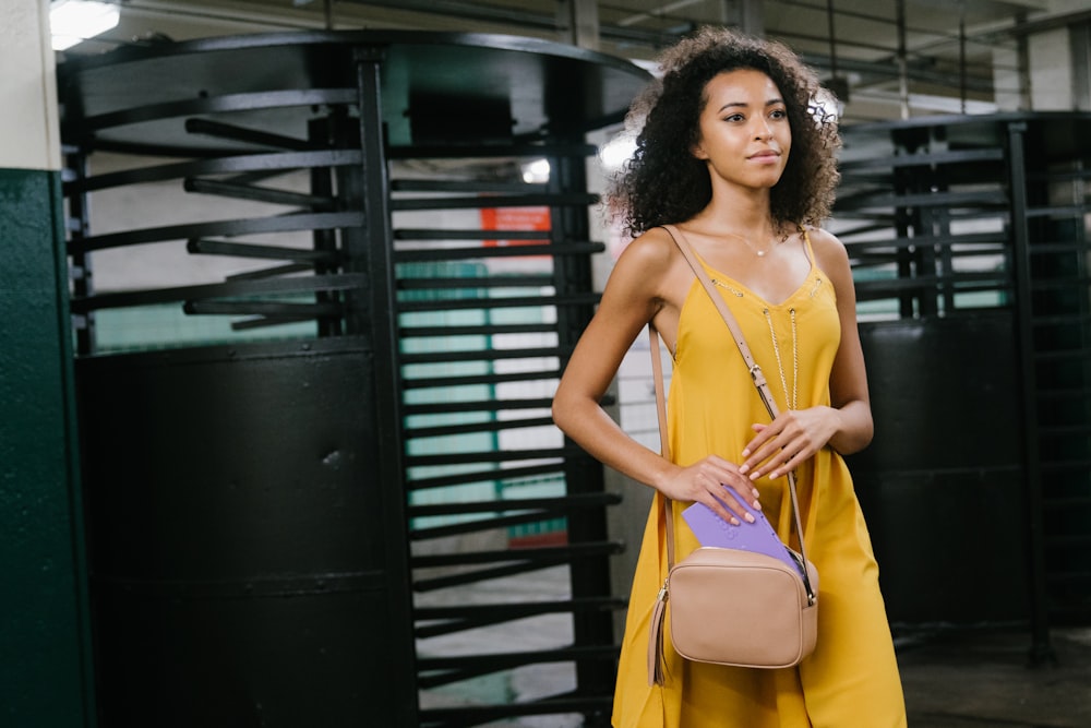 woman in yellow sleeveless dress