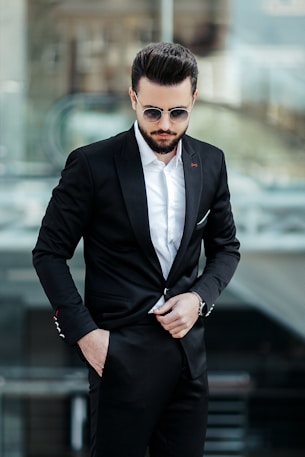 man in black suit jacket and black dress pants