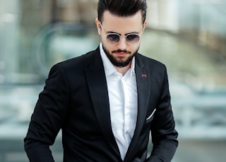 man in black suit jacket and black dress pants