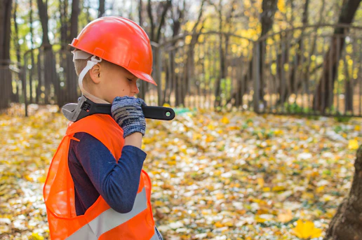A child dressed as a construction worker, a playful nod to the industry Emma works in